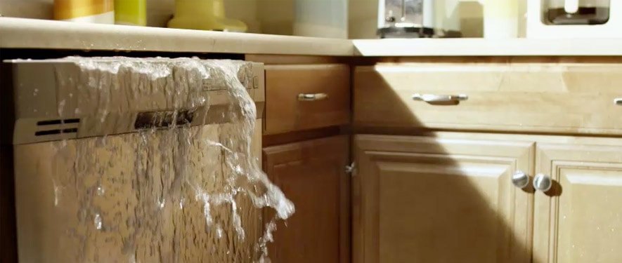 water pouring out of cabinet 